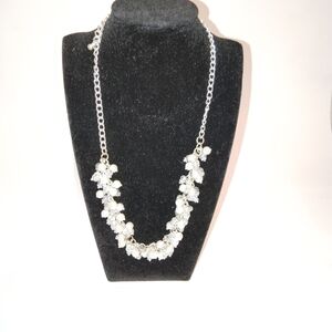 This vintage faux pearl necklace features champagne bubbles in white, making it
